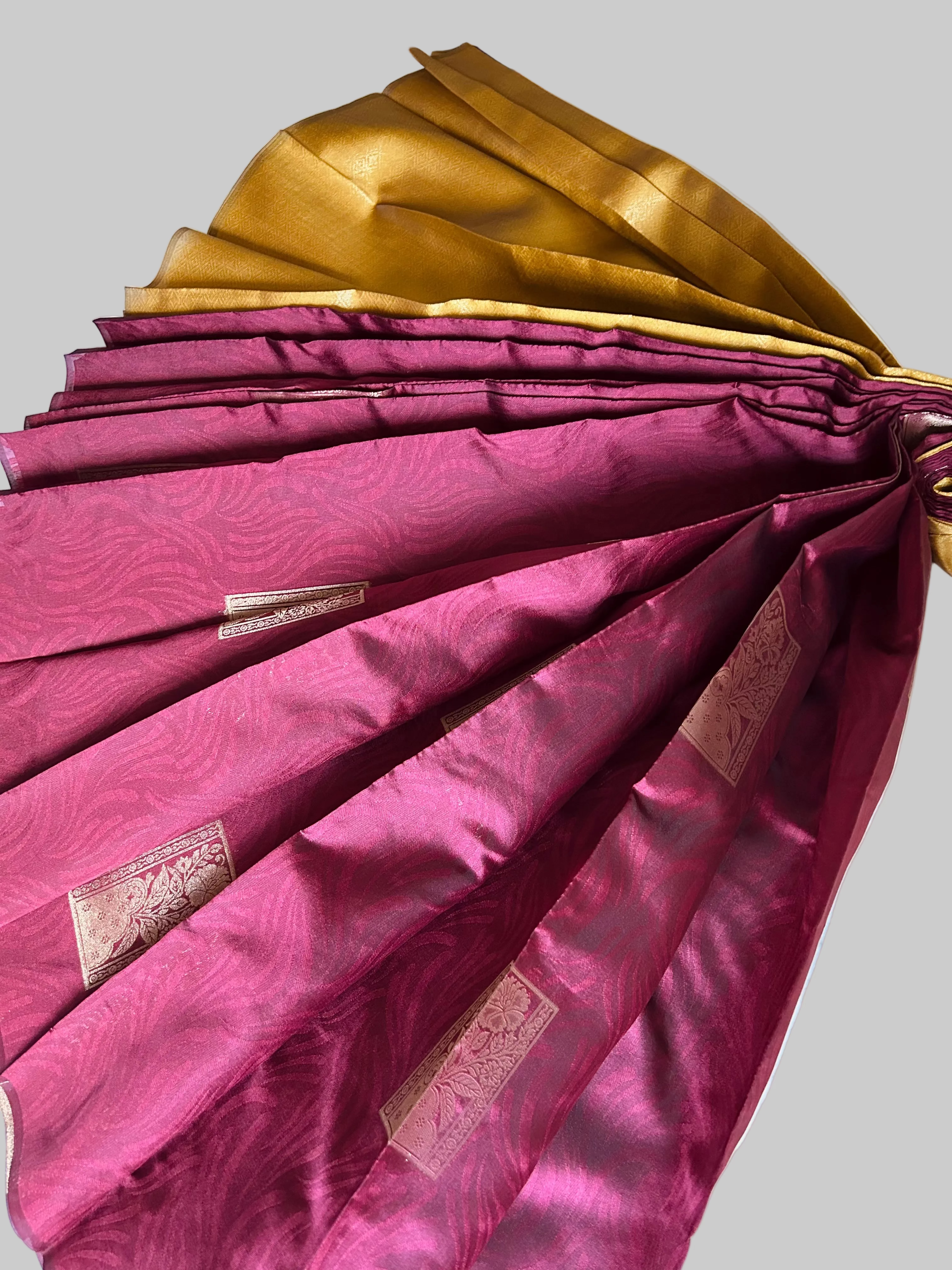 Solid Maroon with golden zari Buta and Pallu Soft Silk Saree